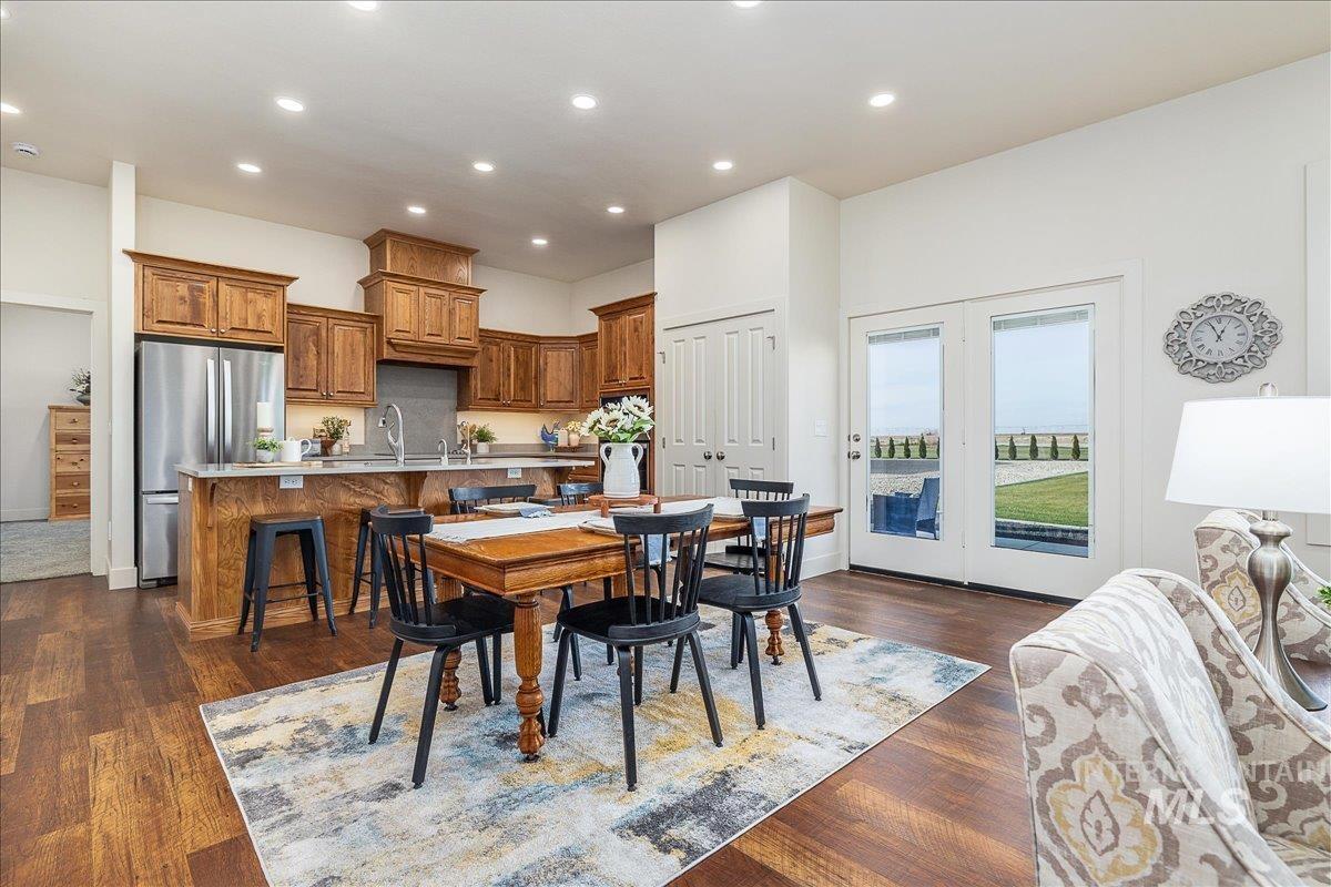 Dining room with recessed lighting and dark wood finished floors