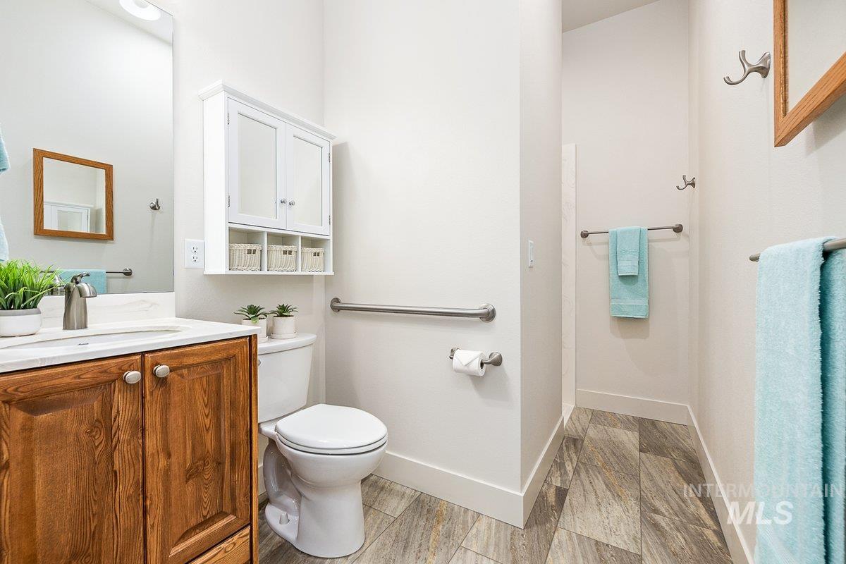 Bathroom featuring vanity, walk-in shower, and medicine cabinet
