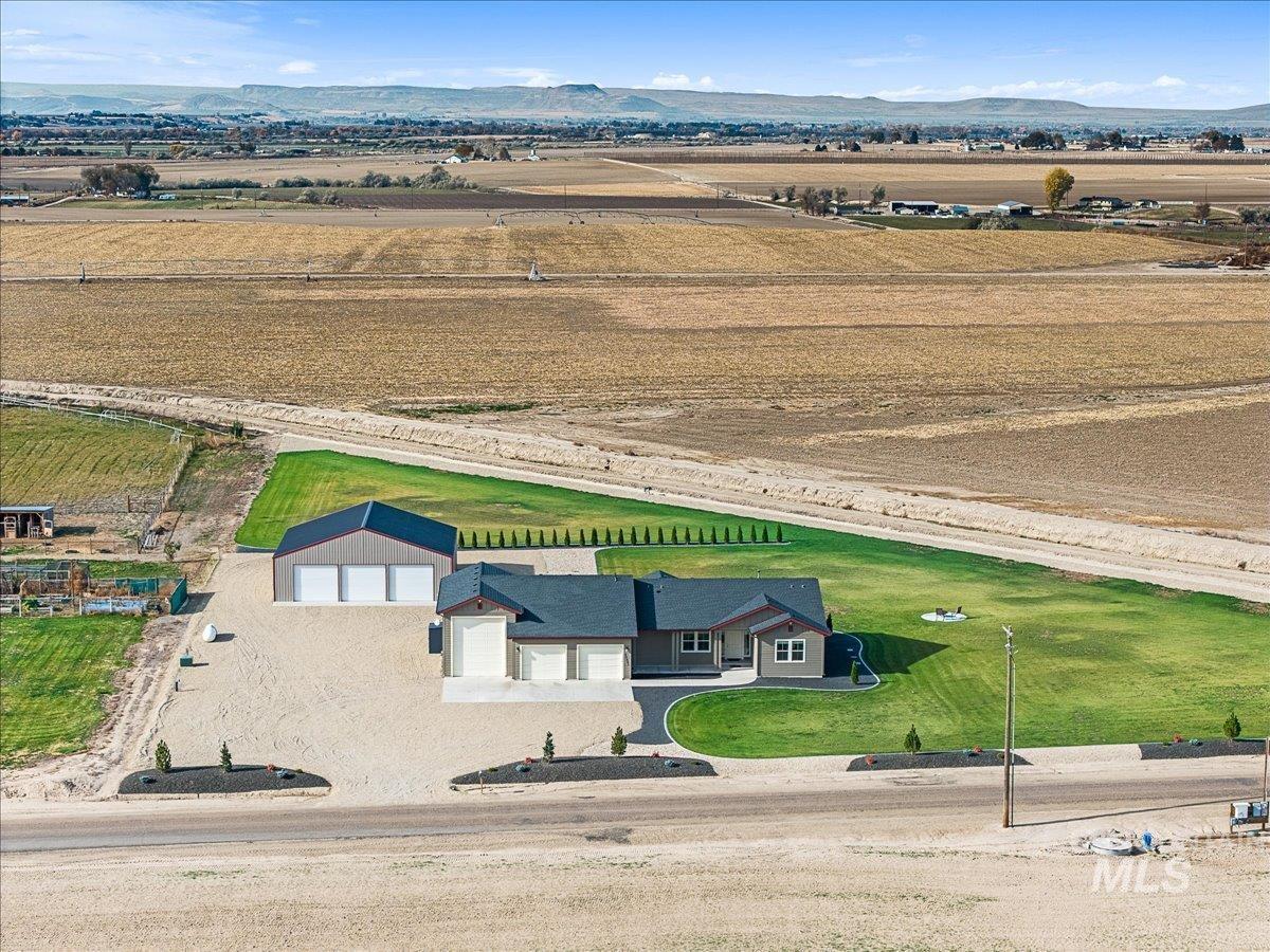 Aerial view of sparsely populated area featuring a mountain backdrop