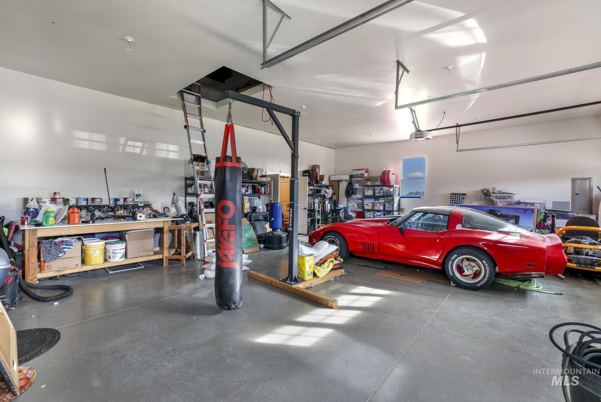 Garage with a workshop area and electric panel