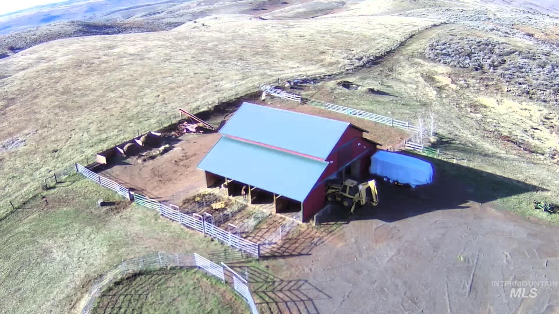 Aerial view of property and surrounding area featuring rural landscape
