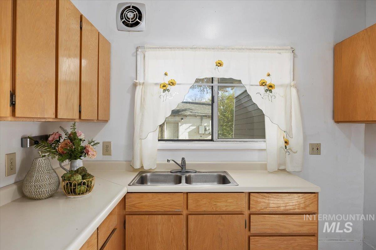 Kitchen featuring light countertops