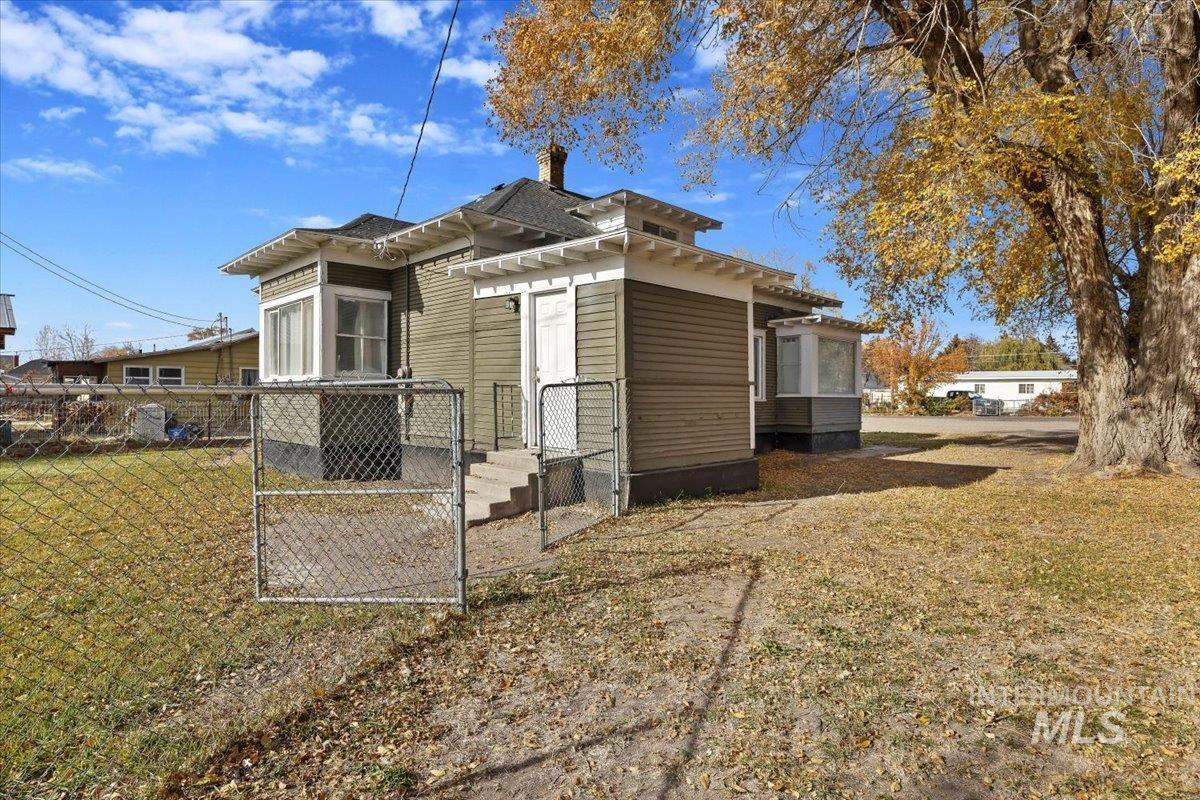 View of home's exterior with a chimney