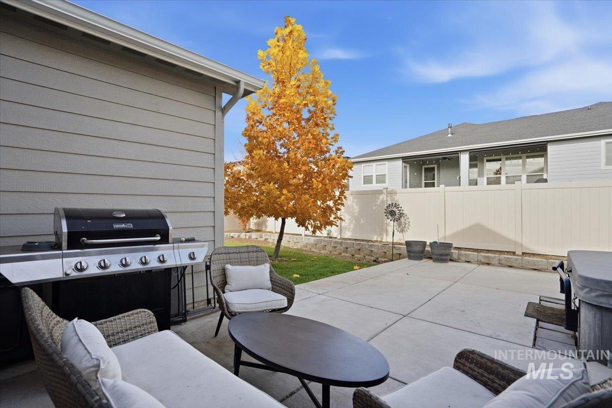 View of patio featuring an outdoor hangout area and grilling area