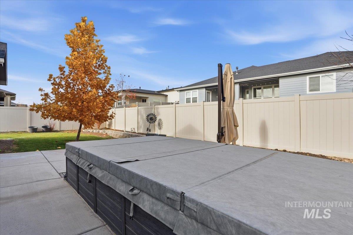 Fenced backyard with a patio