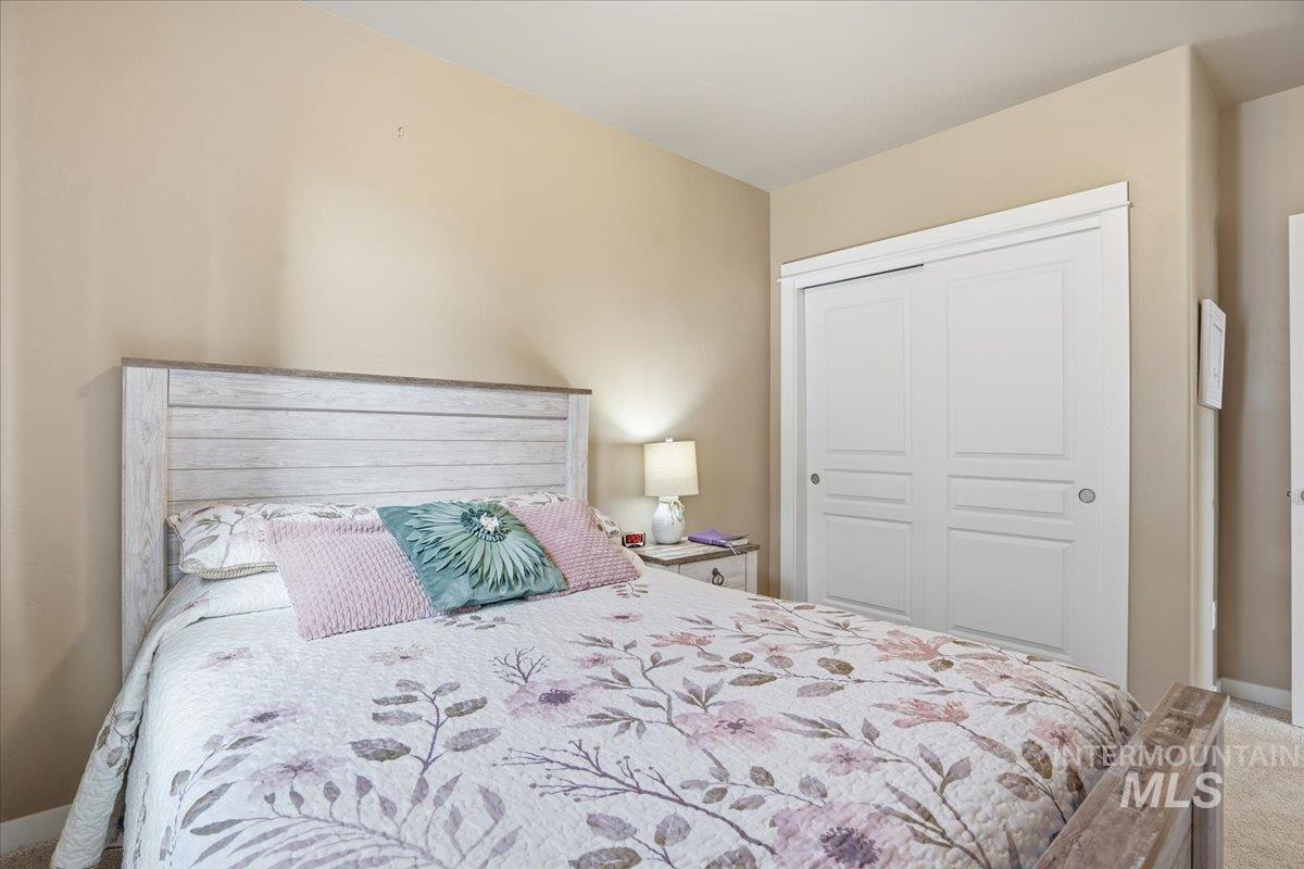 Bedroom with a closet and carpet flooring