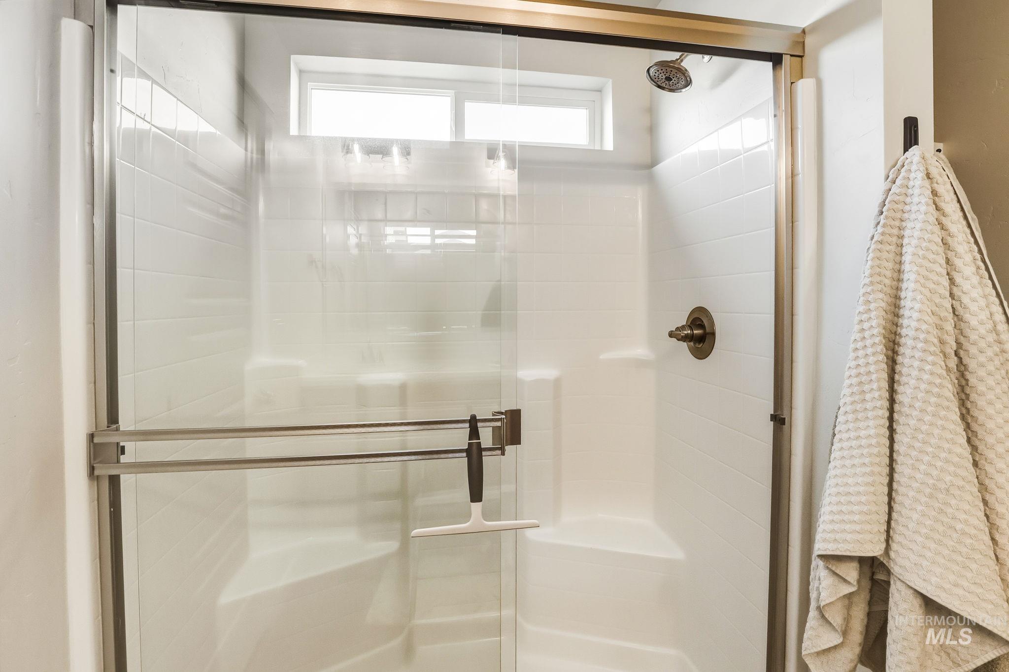 Bathroom featuring a shower stall