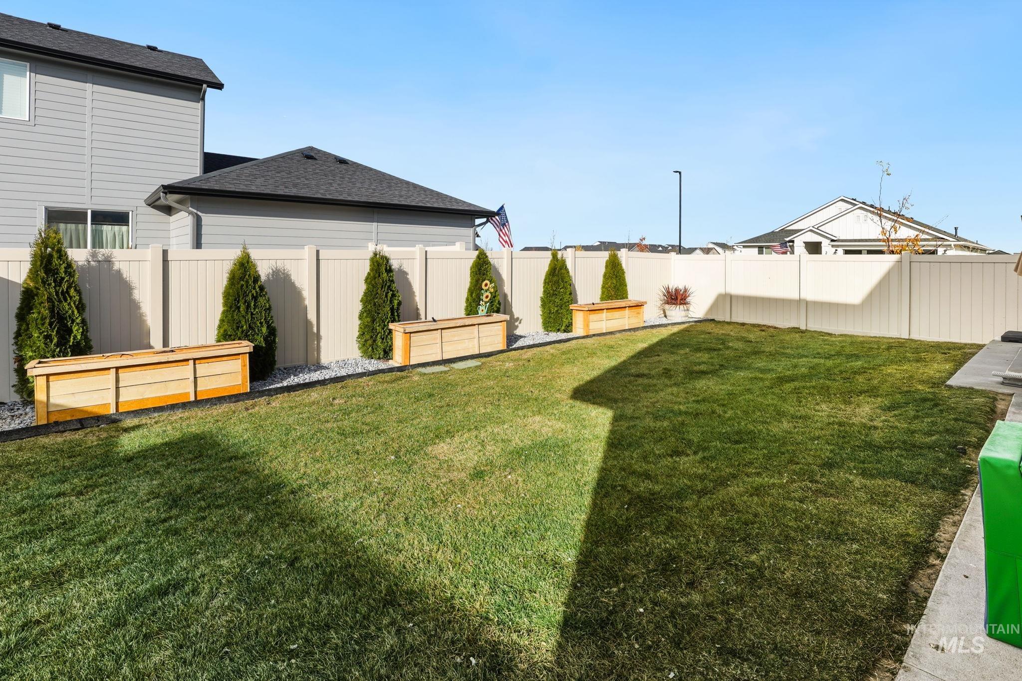 View of fenced backyard