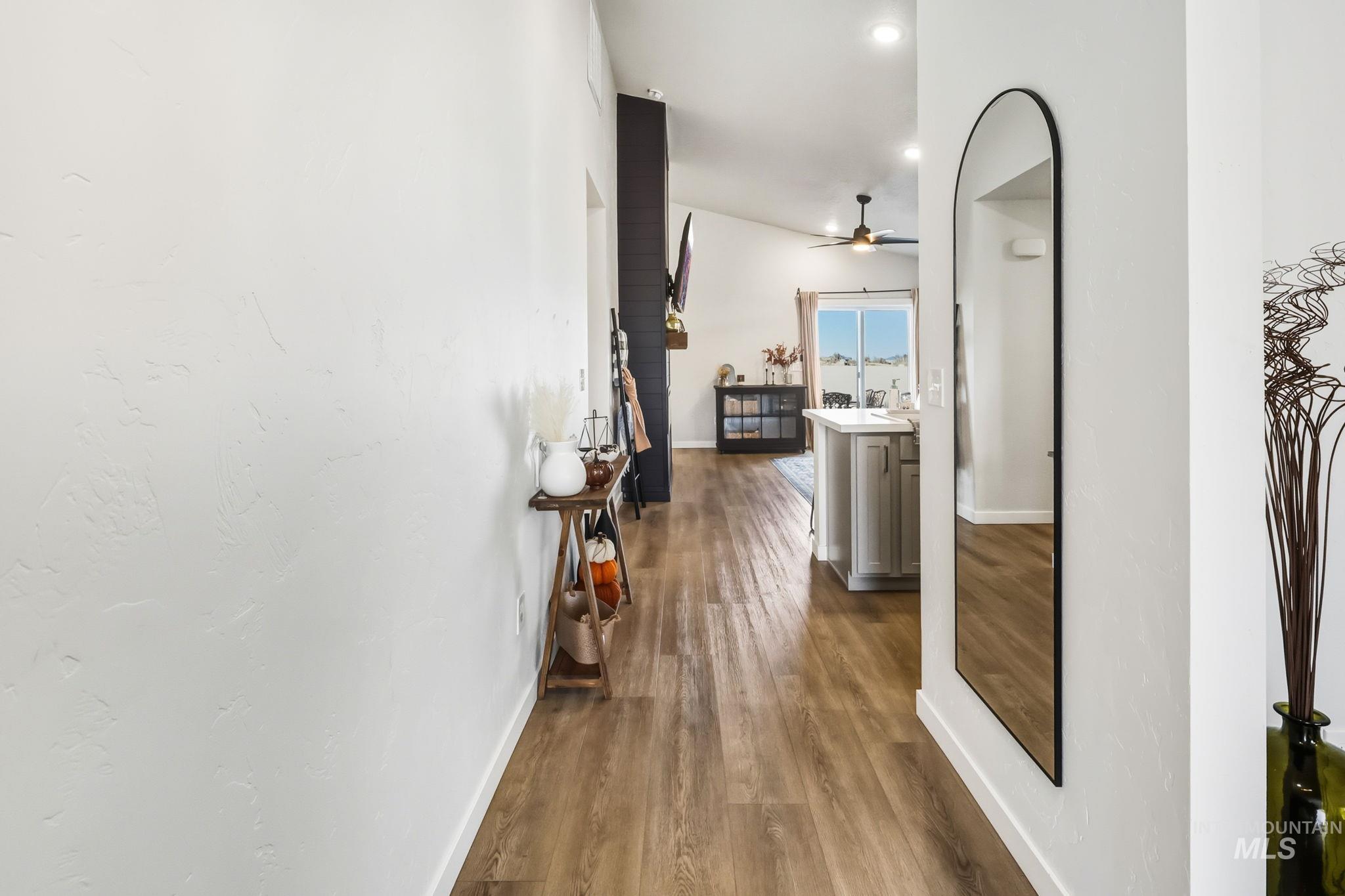 Corridor featuring dark wood-style floors and recessed lighting