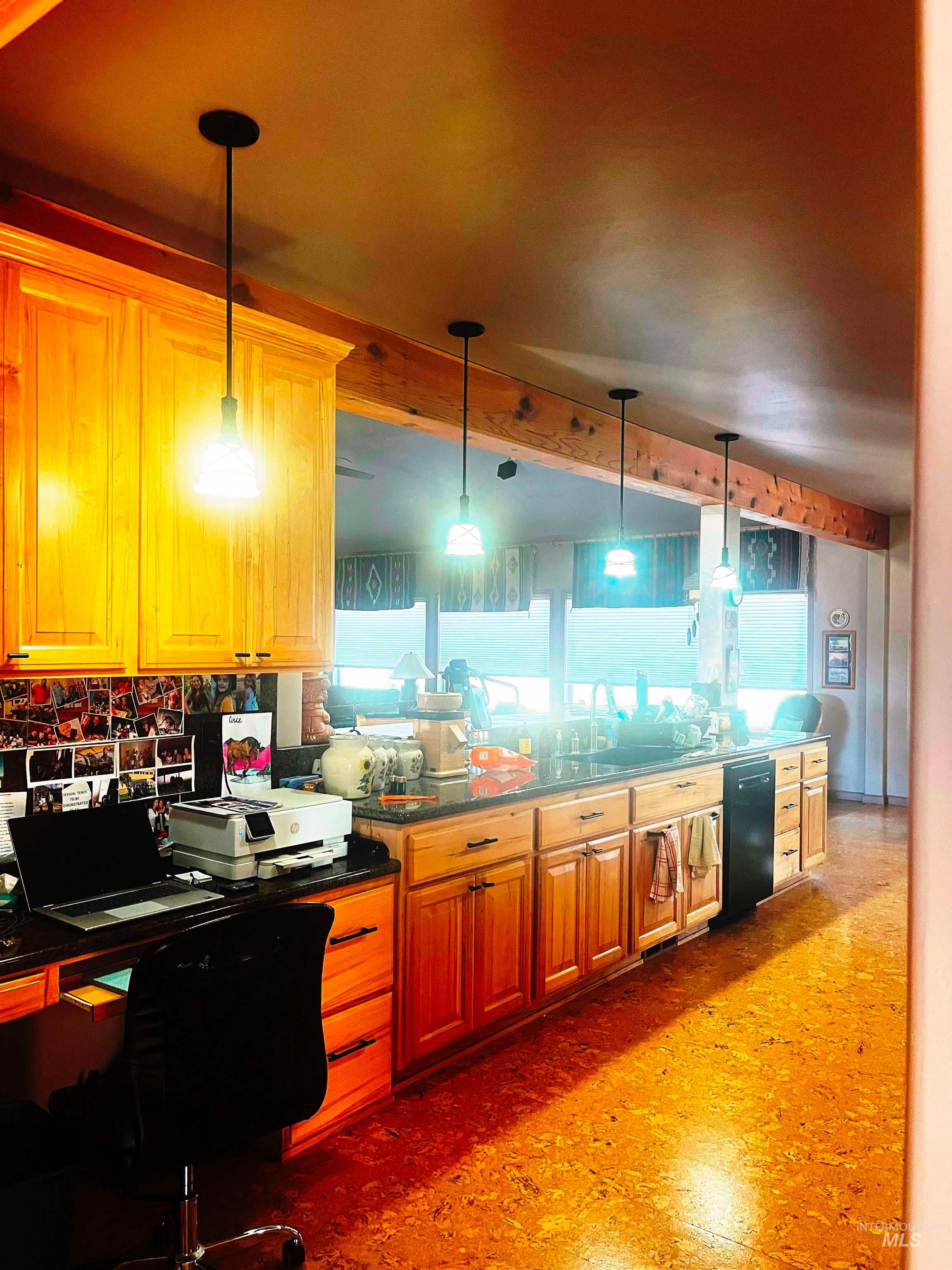 Kitchen featuring brown cabinetry