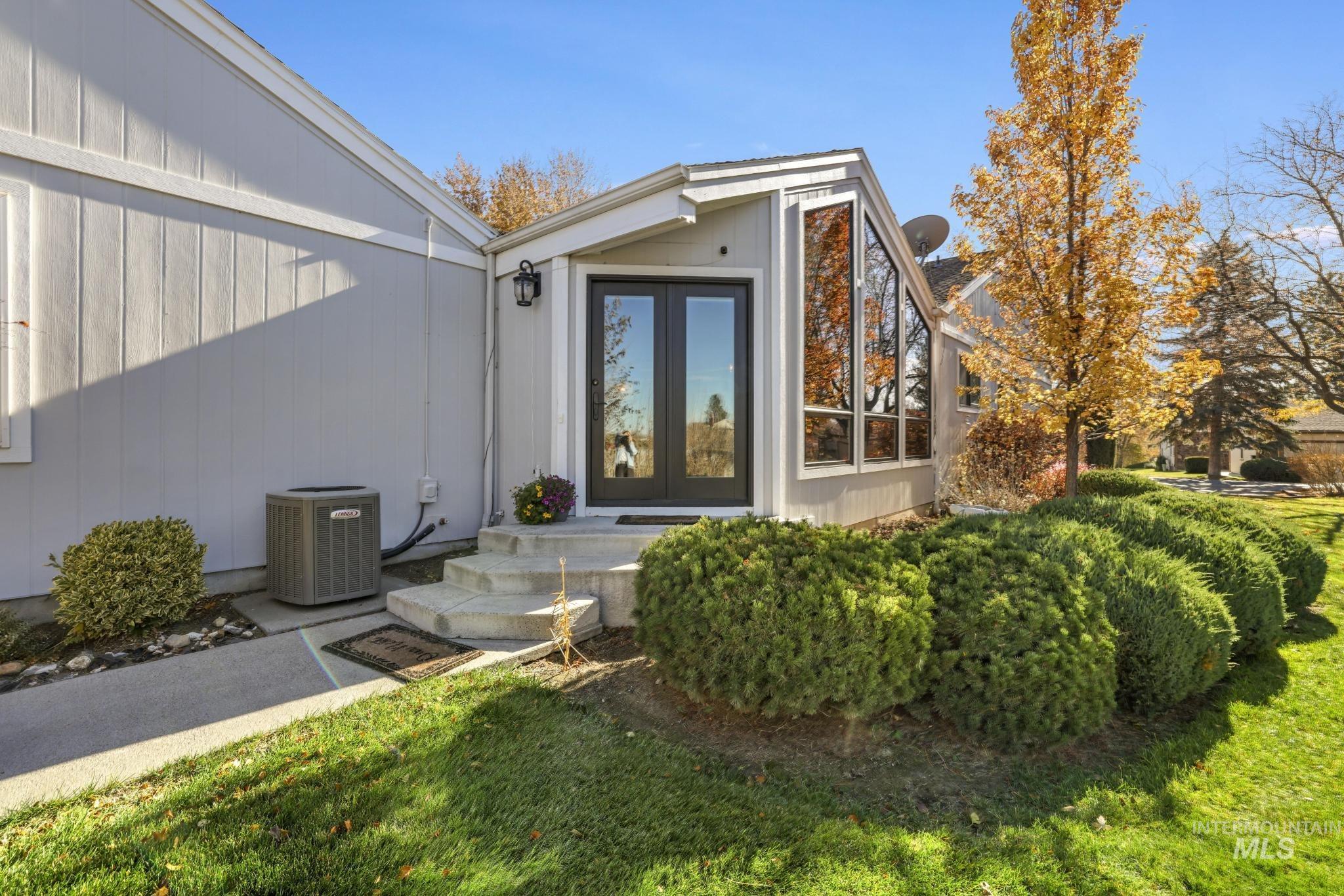 View of exterior entry featuring french doors