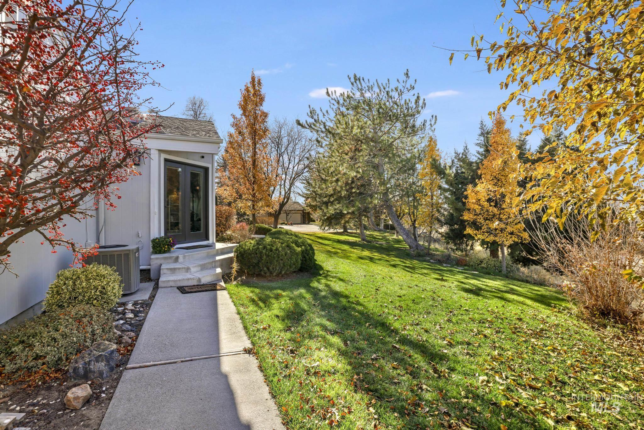 View of grassy yard with french doors