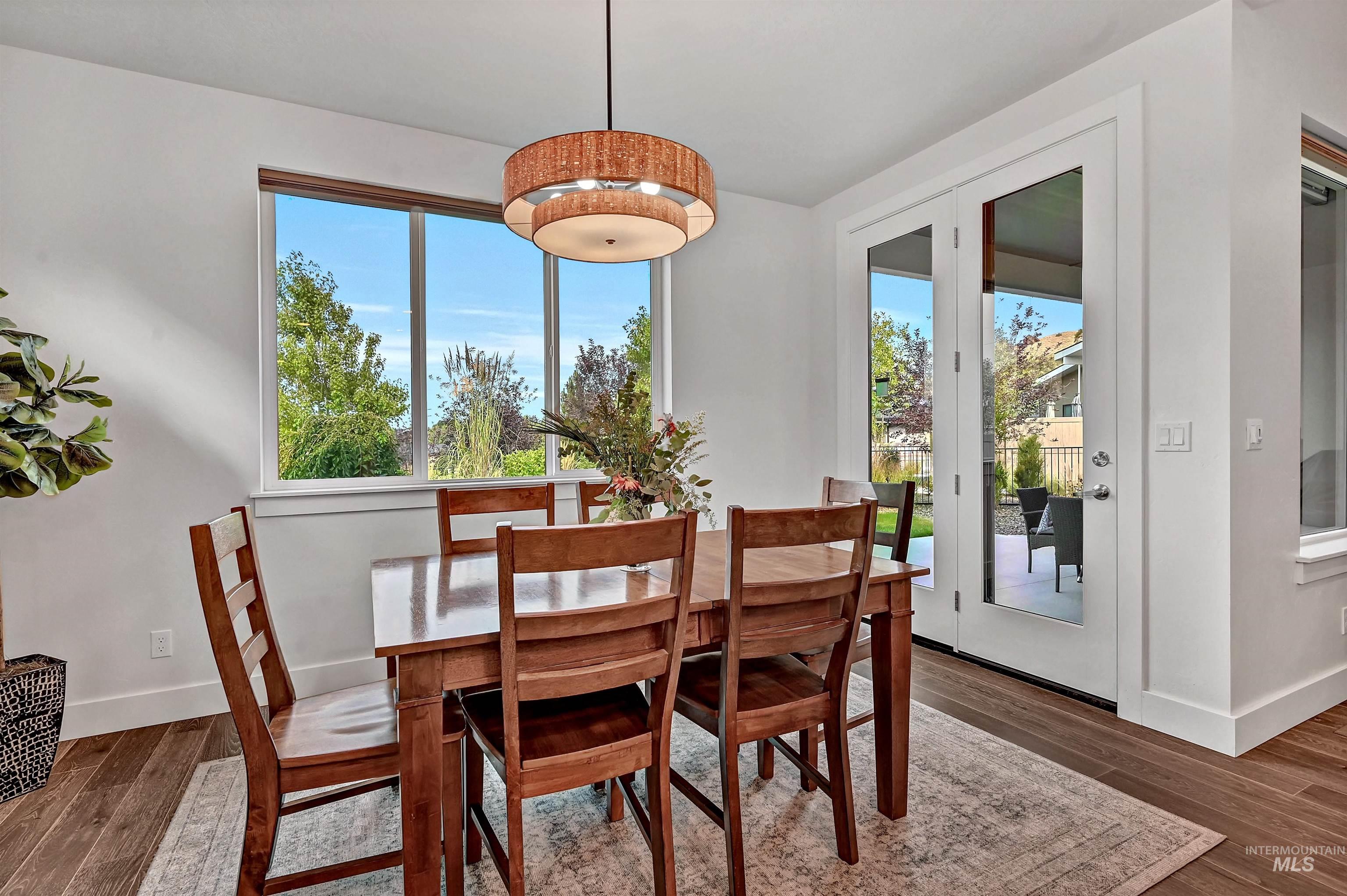 Dining room with wood finished floors and baseboards