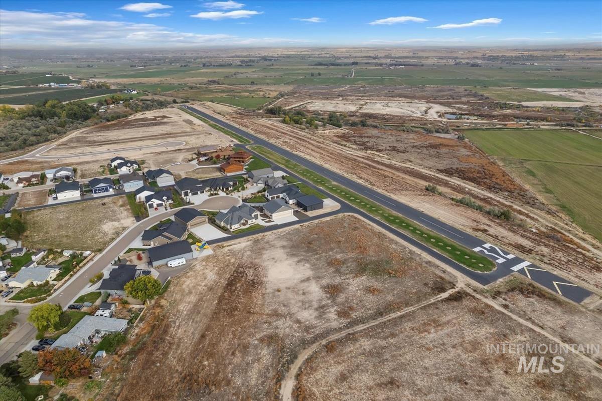 View of property location with nearby suburban area