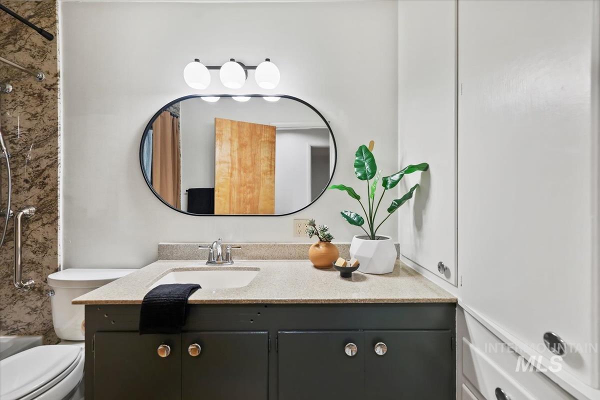 Full bathroom featuring vanity and shower / tub combination