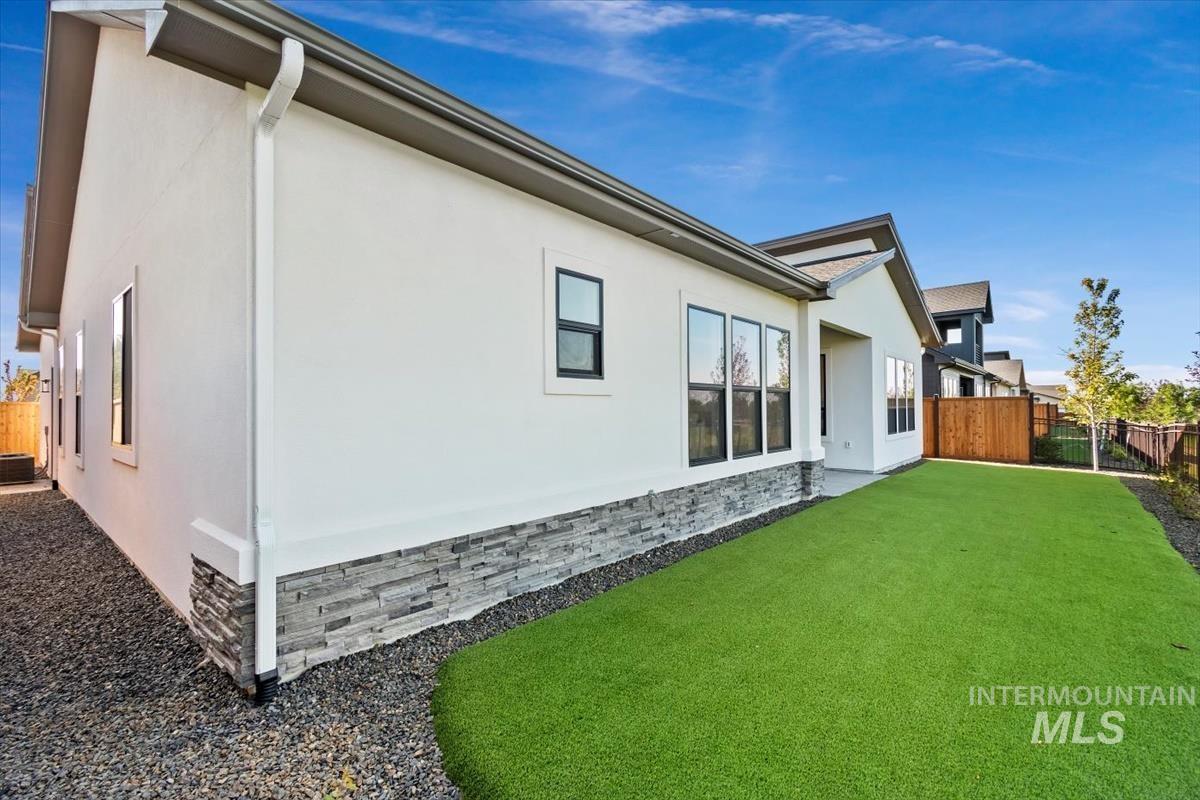 View of side of property with stucco siding