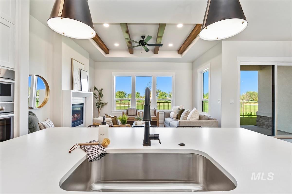 Kitchen with plenty of natural light, light countertops, and recessed lighting