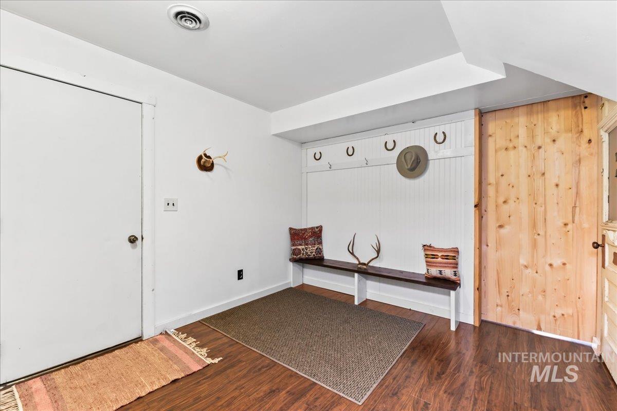 Entryway with dark wood finished floors