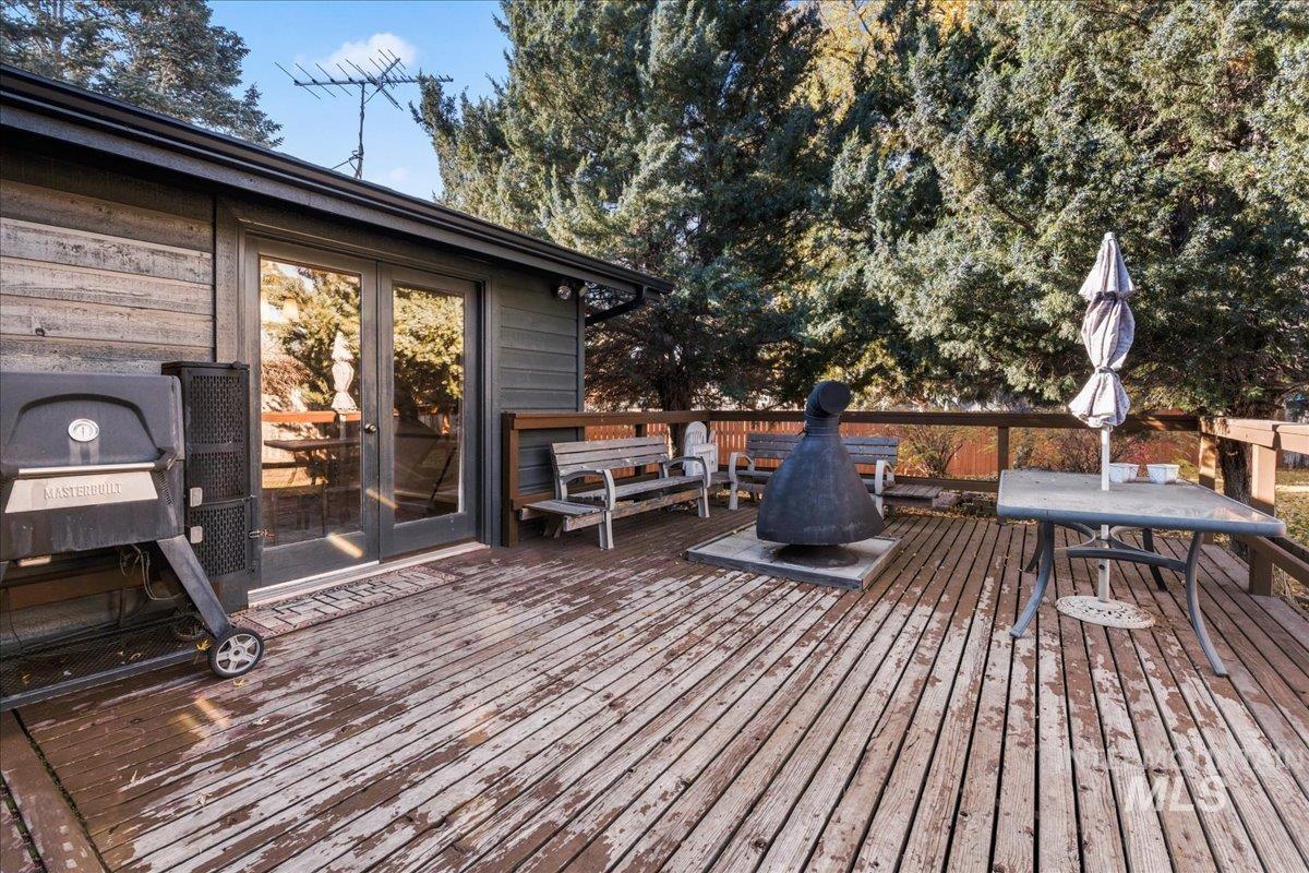 Wooden terrace featuring french doors