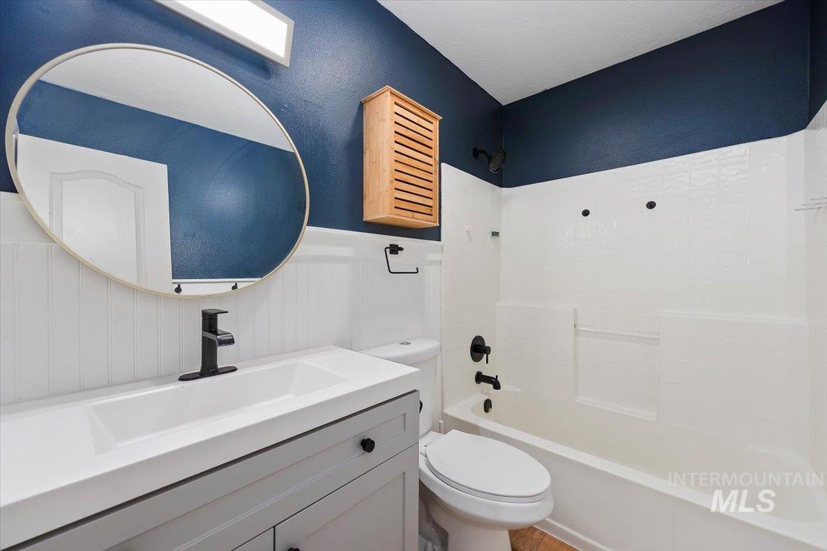 Bathroom with tub / shower combination and vanity