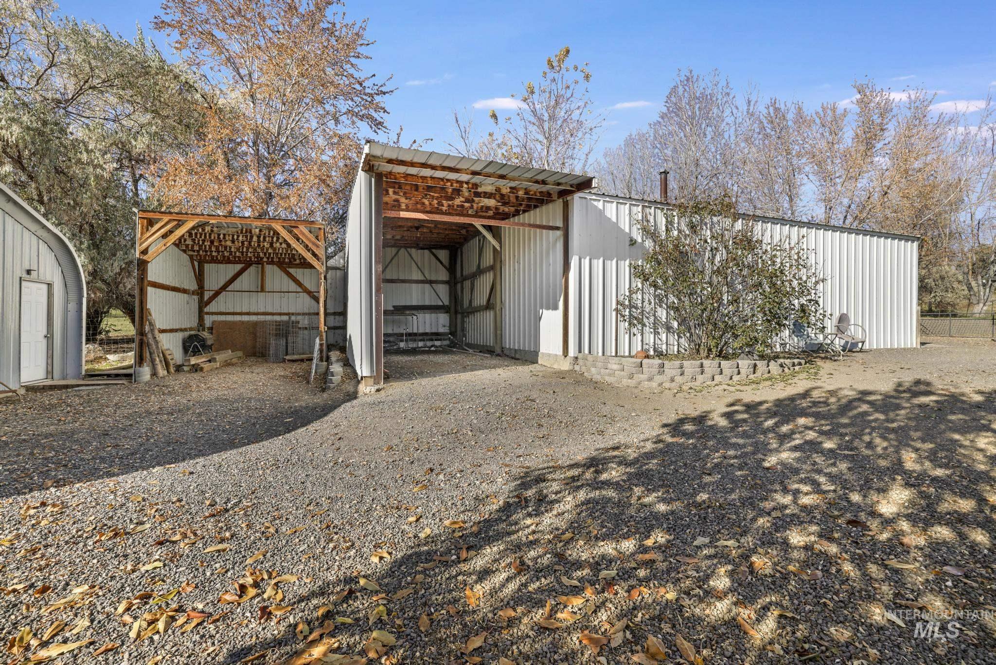 View of pole building with a carport
