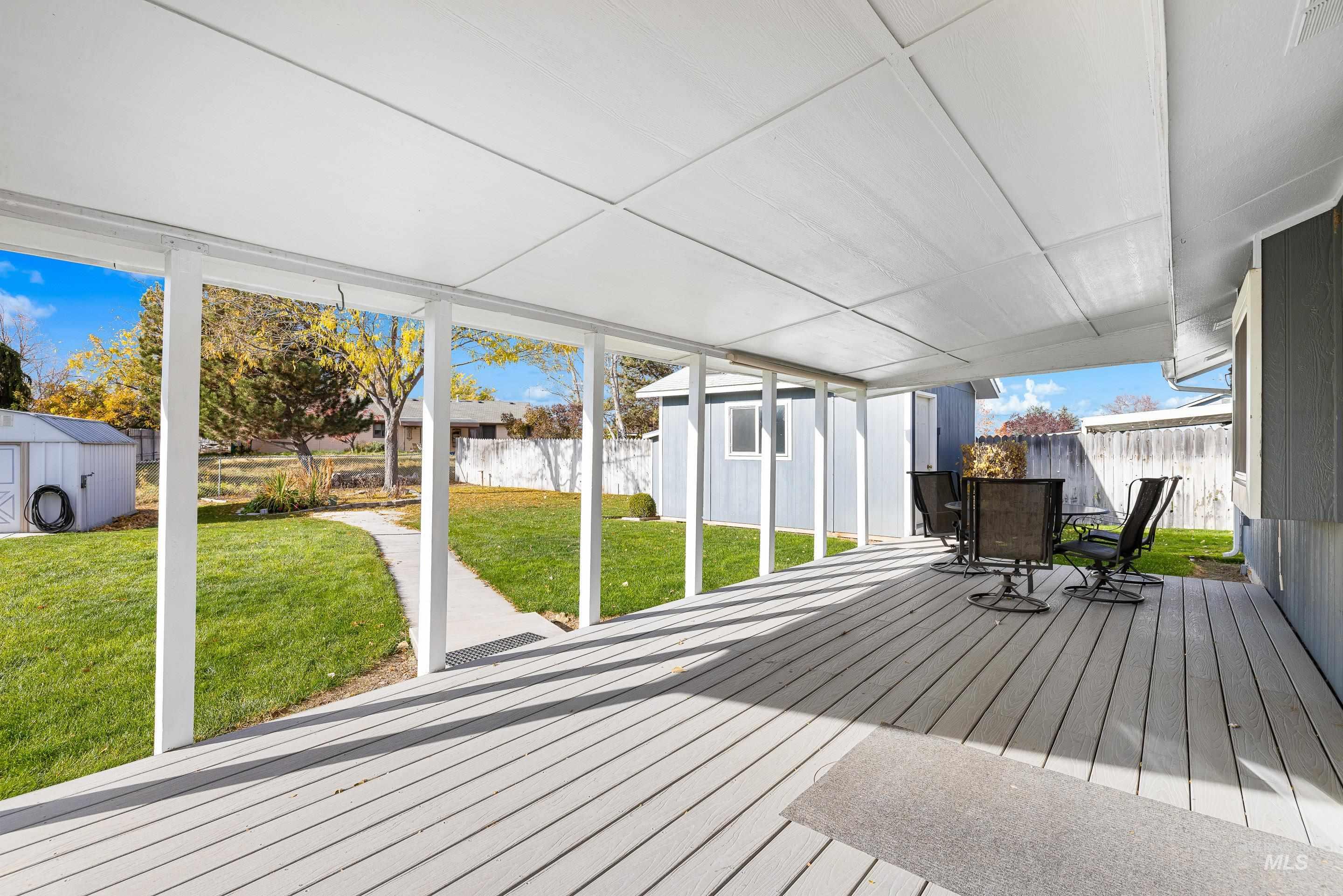 Sunroom / solarium featuring outdoor dining space and a deck