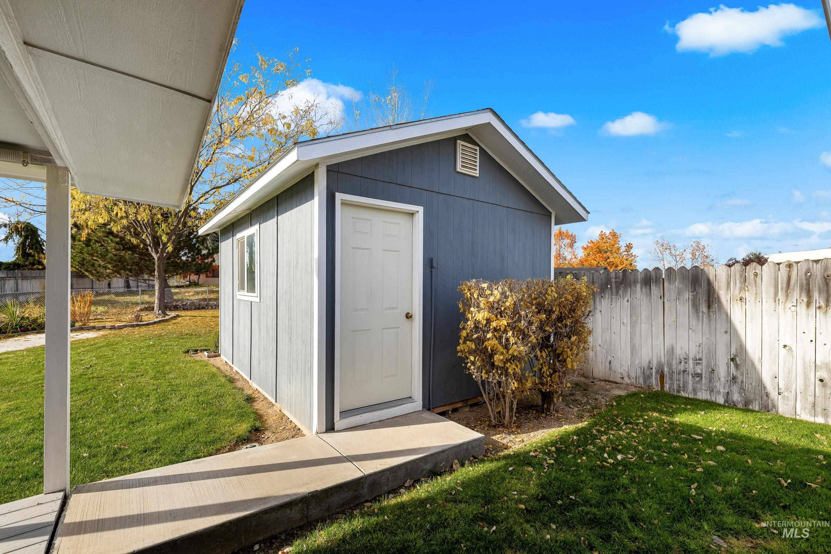View of shed with a fenced backyard