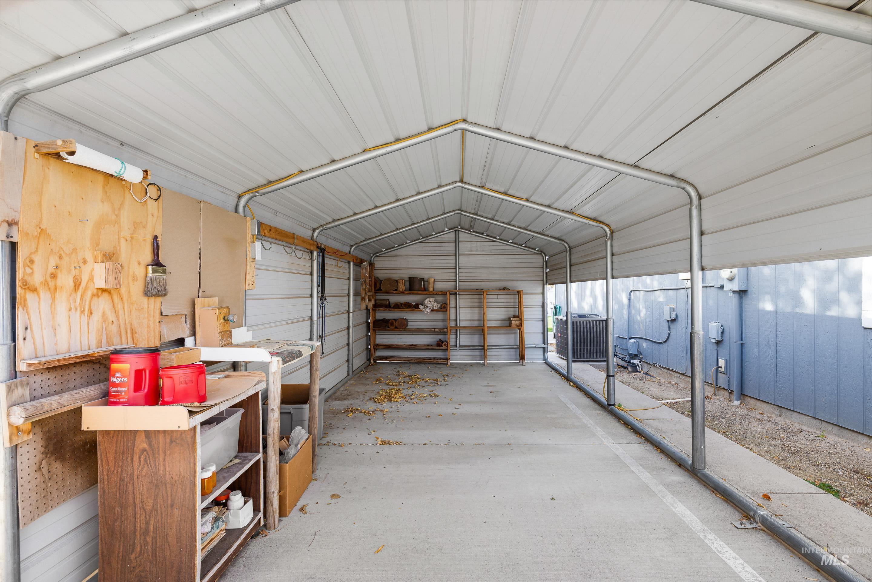 Garage featuring metal wall