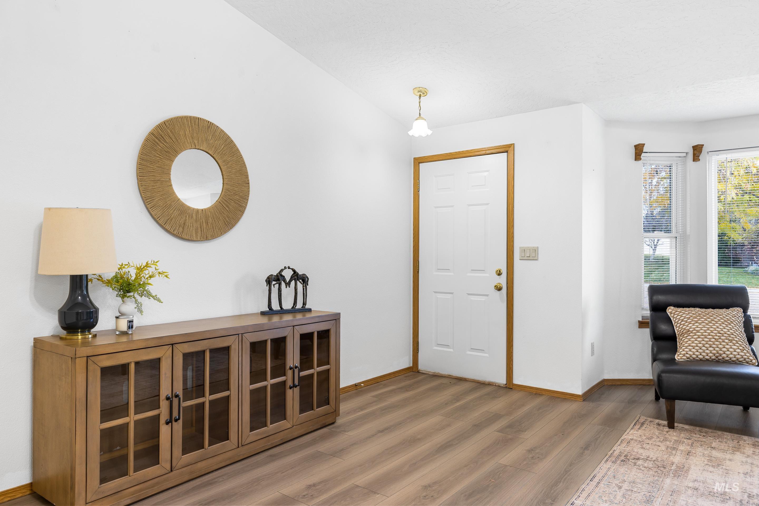 Entryway featuring light wood-style floors and baseboards
