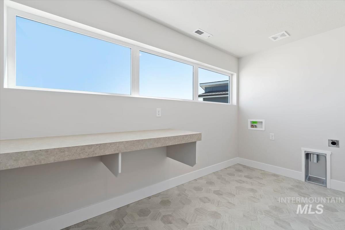 Laundry area with washer hookup and electric dryer hookup