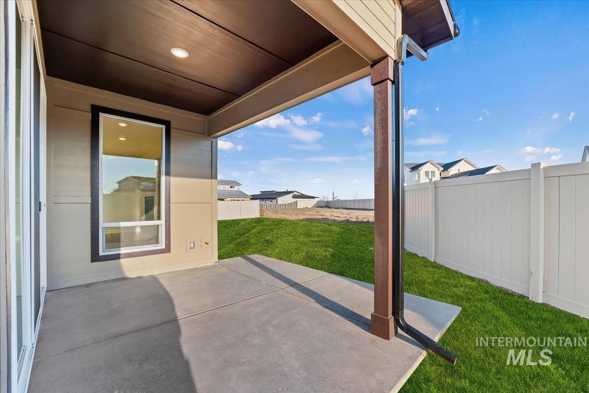 Fenced backyard featuring a patio