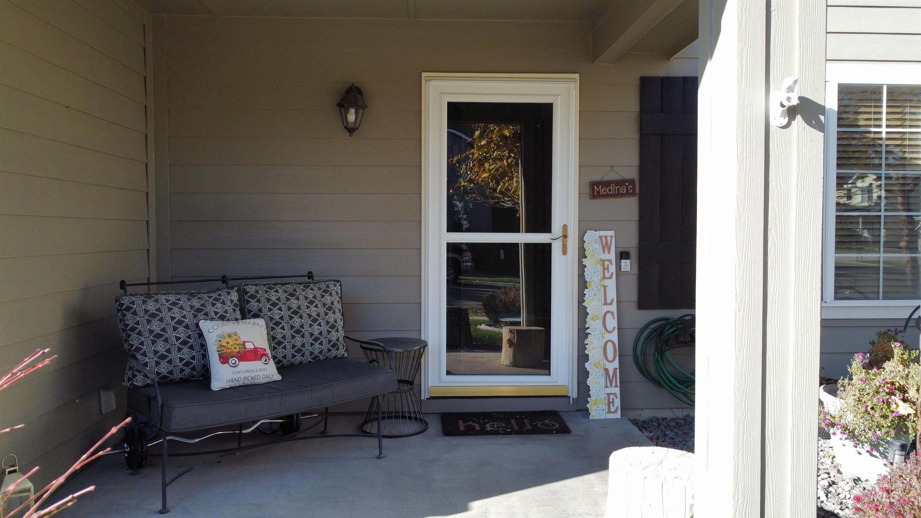 Property entrance featuring a patio area