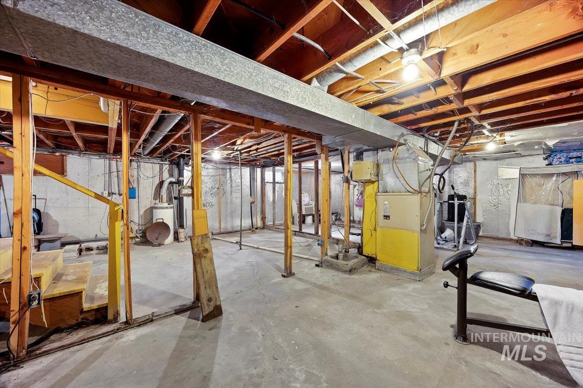 Unfinished below grade area with heating unit