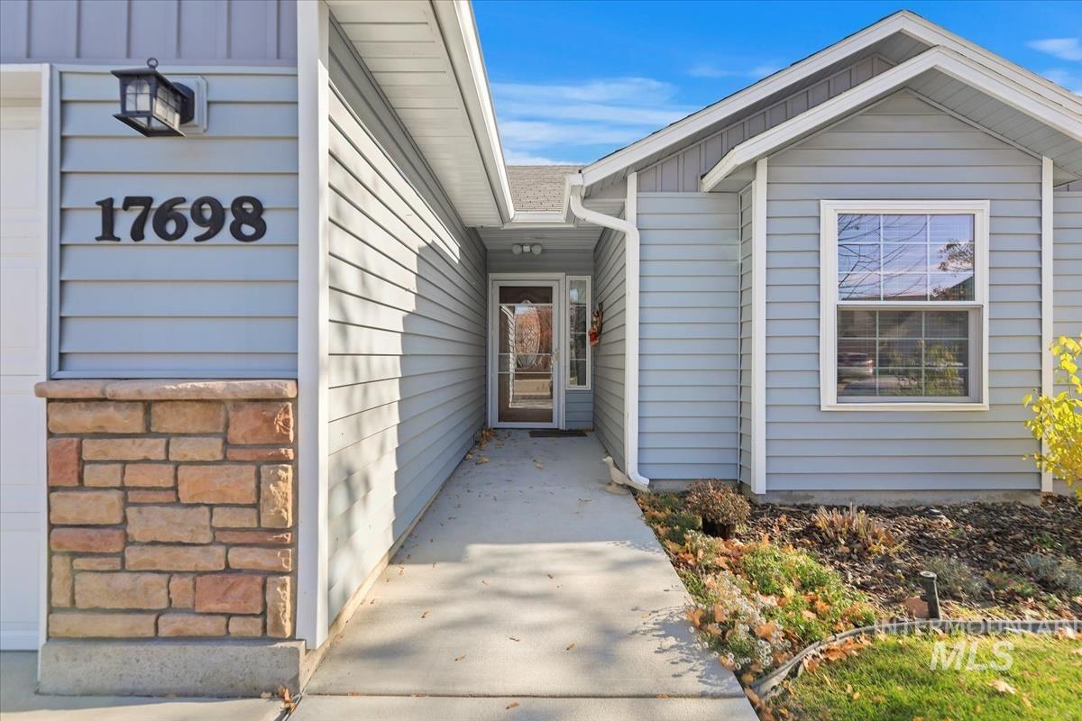 Doorway to property with board and batten siding