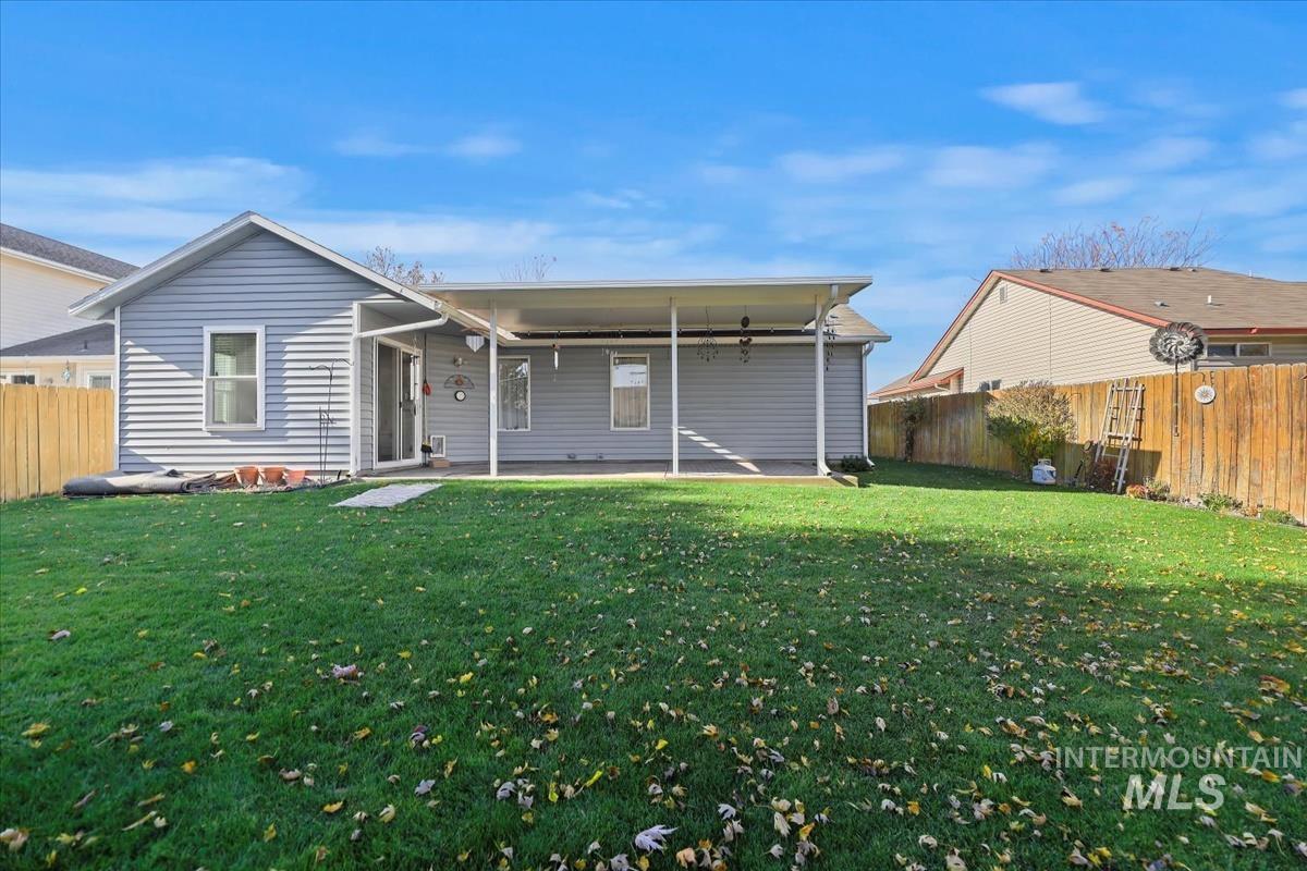 Back of property featuring a patio area and a fenced backyard