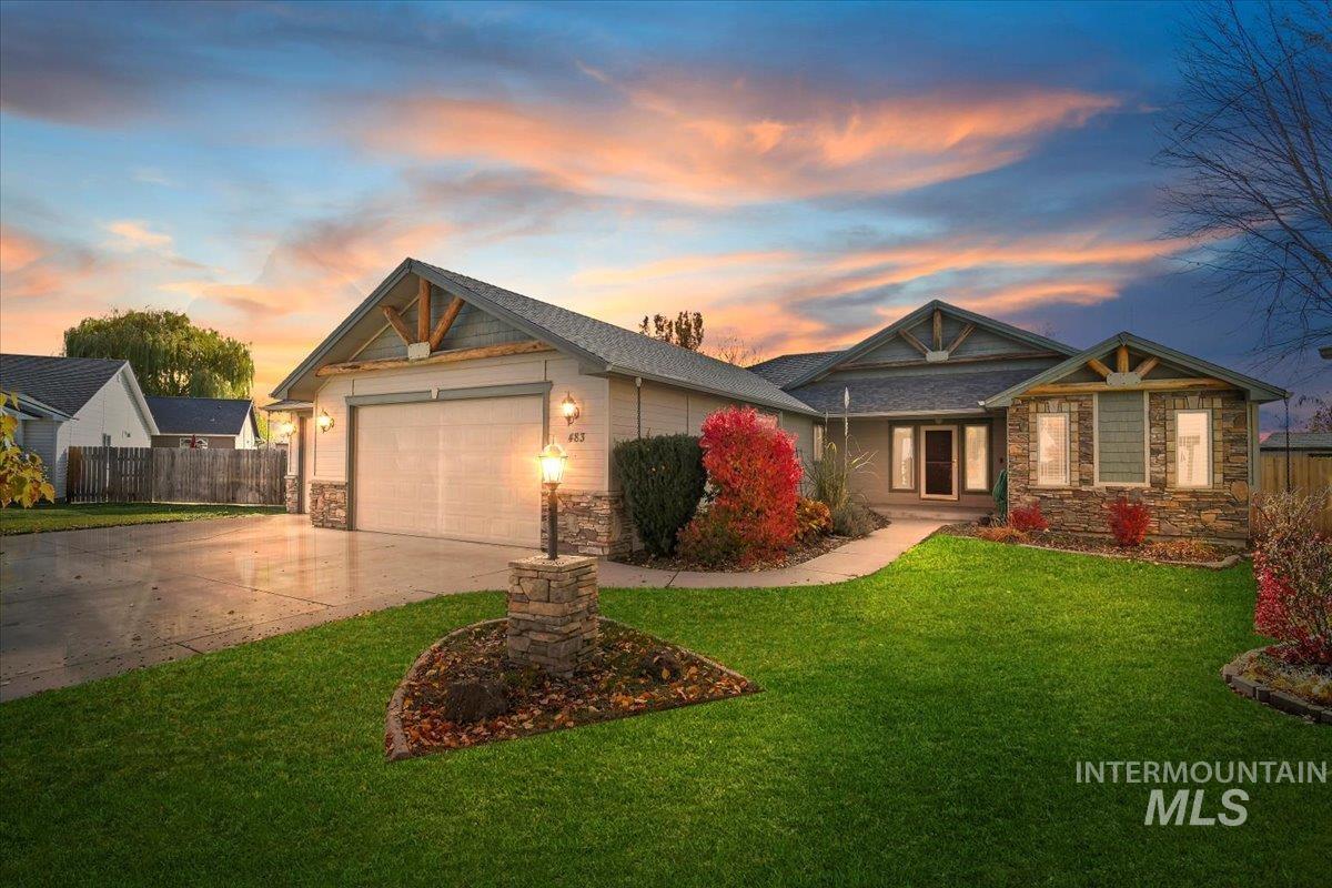 Craftsman inspired home with stone siding, concrete driveway, an attached garage, and a porch