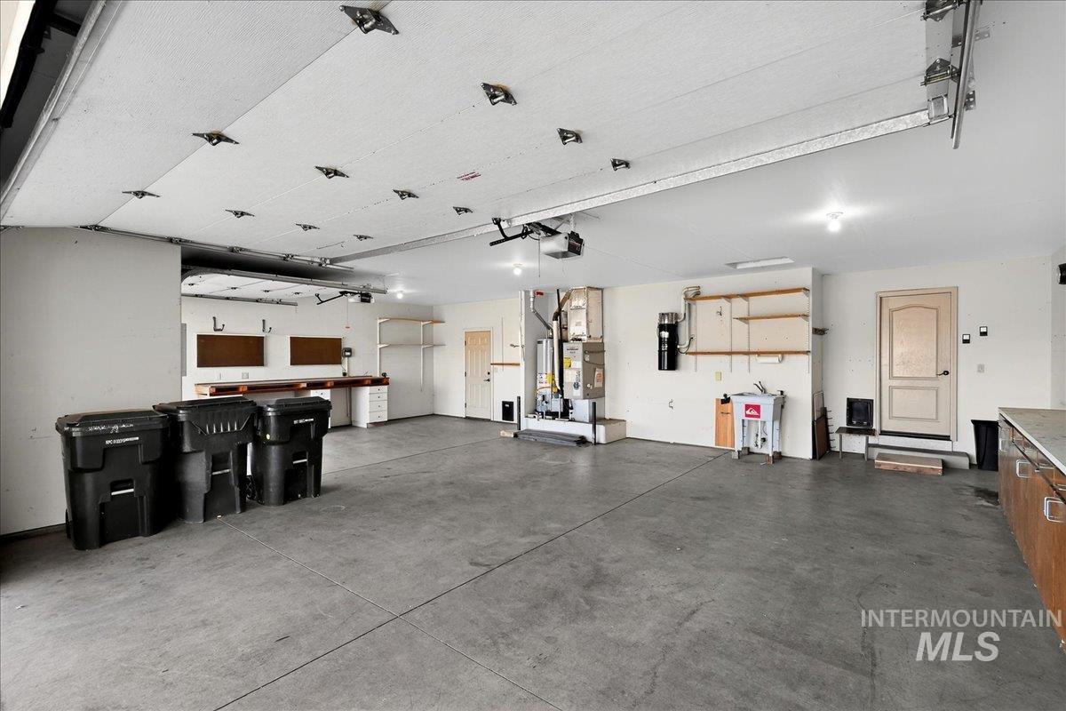 Garage with a workshop area and a central vacuum unit