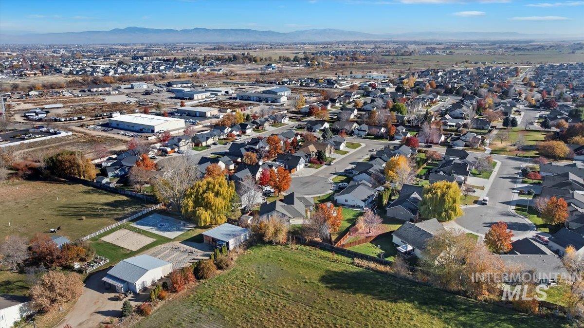 View of property location featuring a mountain backdrop and nearby suburban area