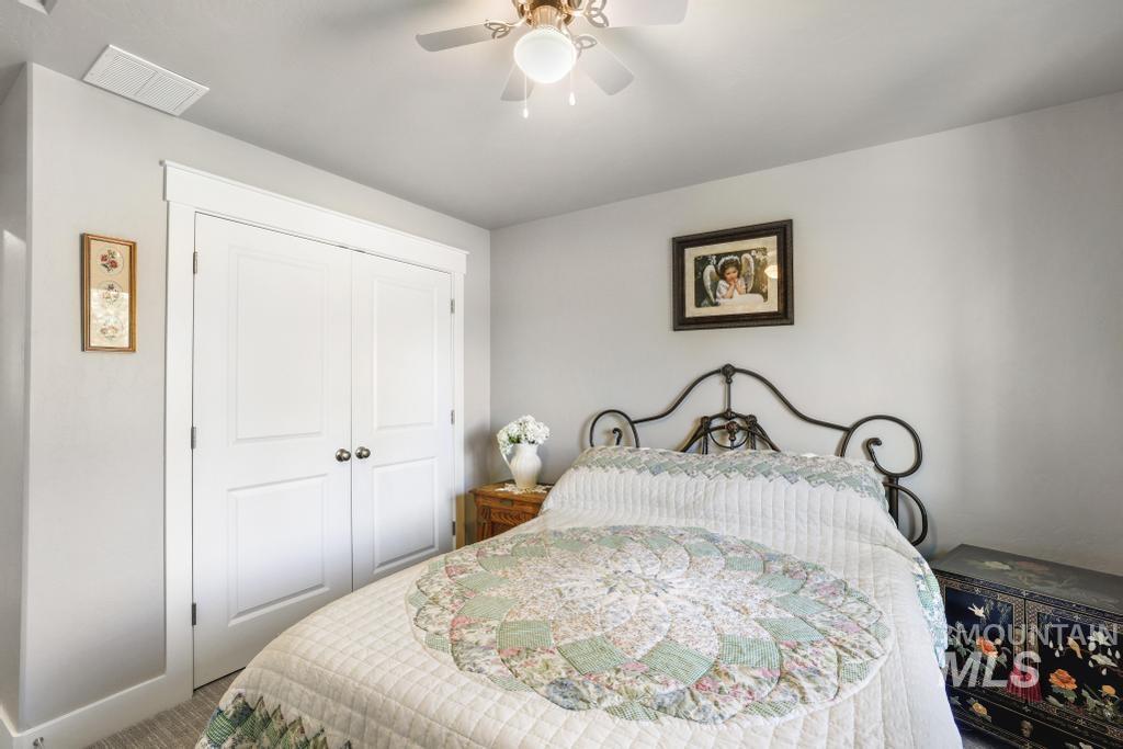Bedroom featuring a closet and a ceiling fan