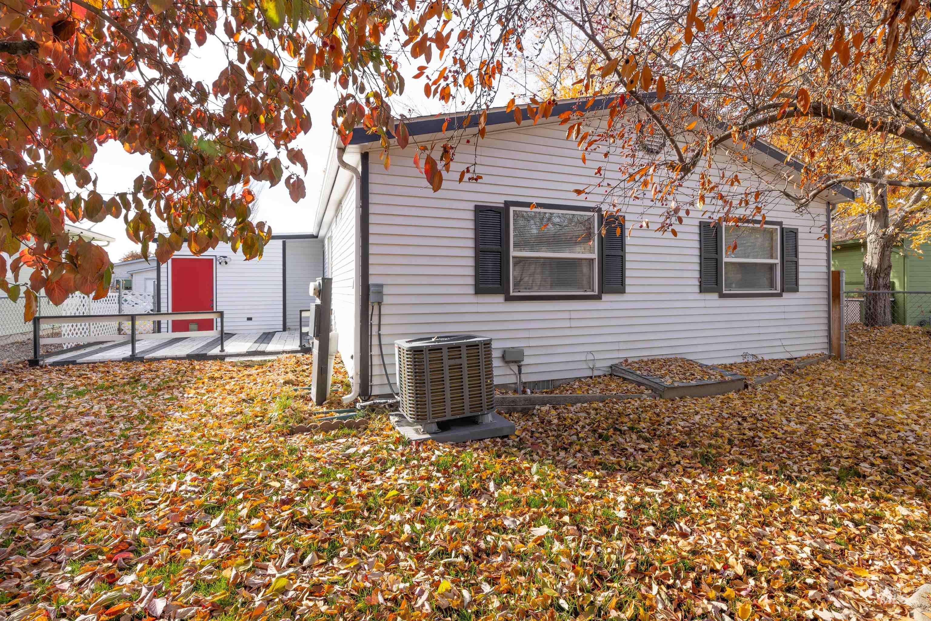 View of property exterior featuring a central air condition unit and a patio