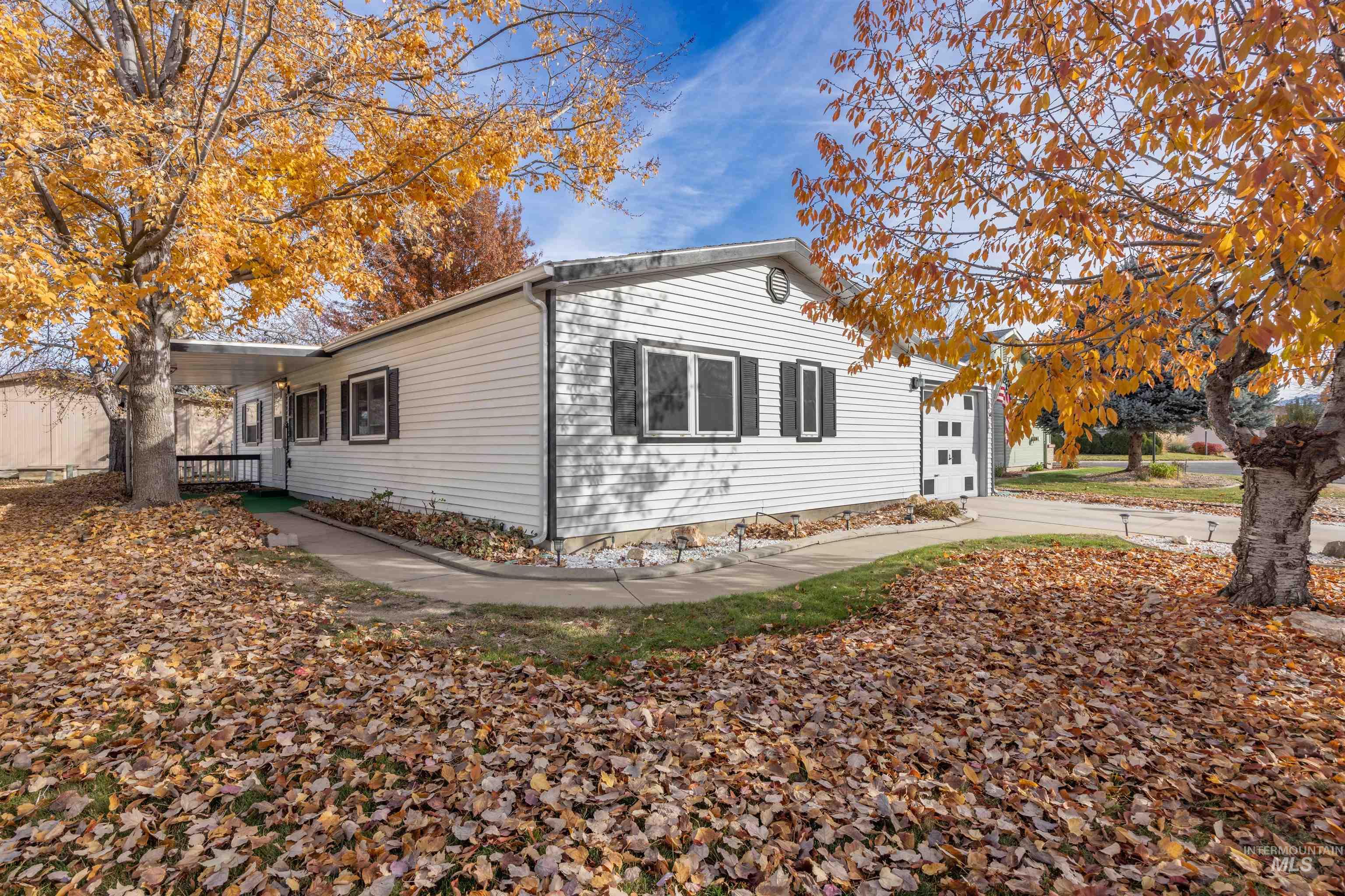 View of property exterior with concrete driveway