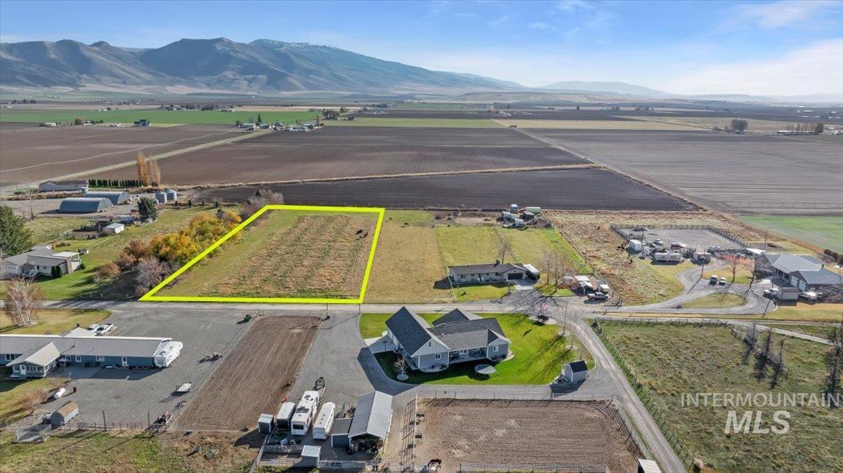 View of rural area featuring property boundaries highlighted and a mountain backdrop