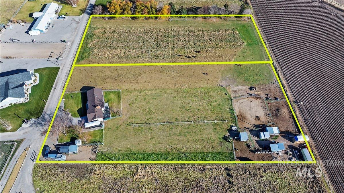 View of rural area featuring rows of crops and property parcel outlined