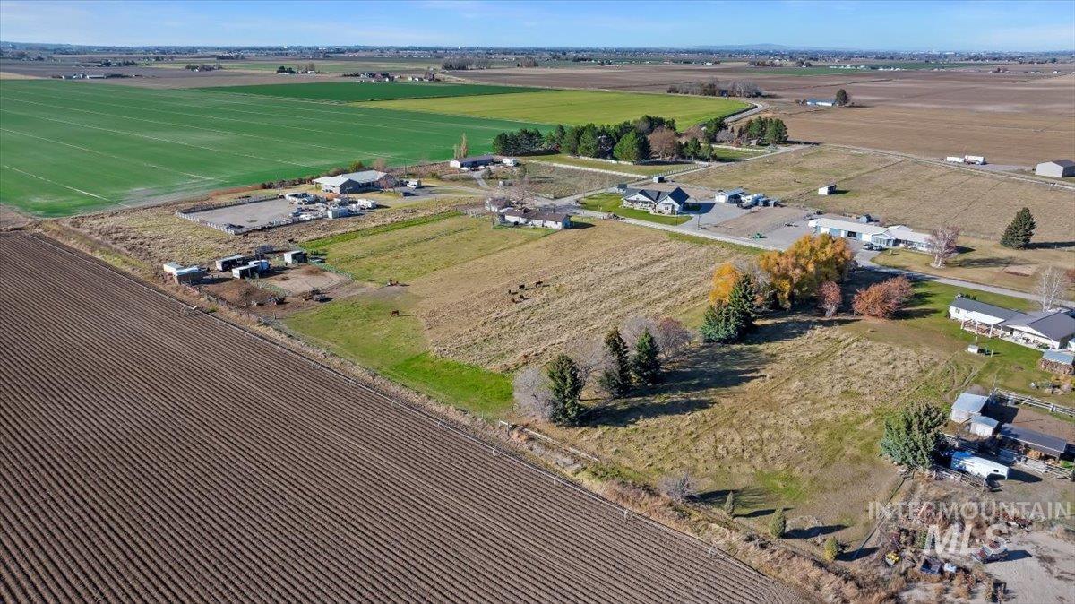 Aerial view of property's location featuring rural landscape and abundant farmland