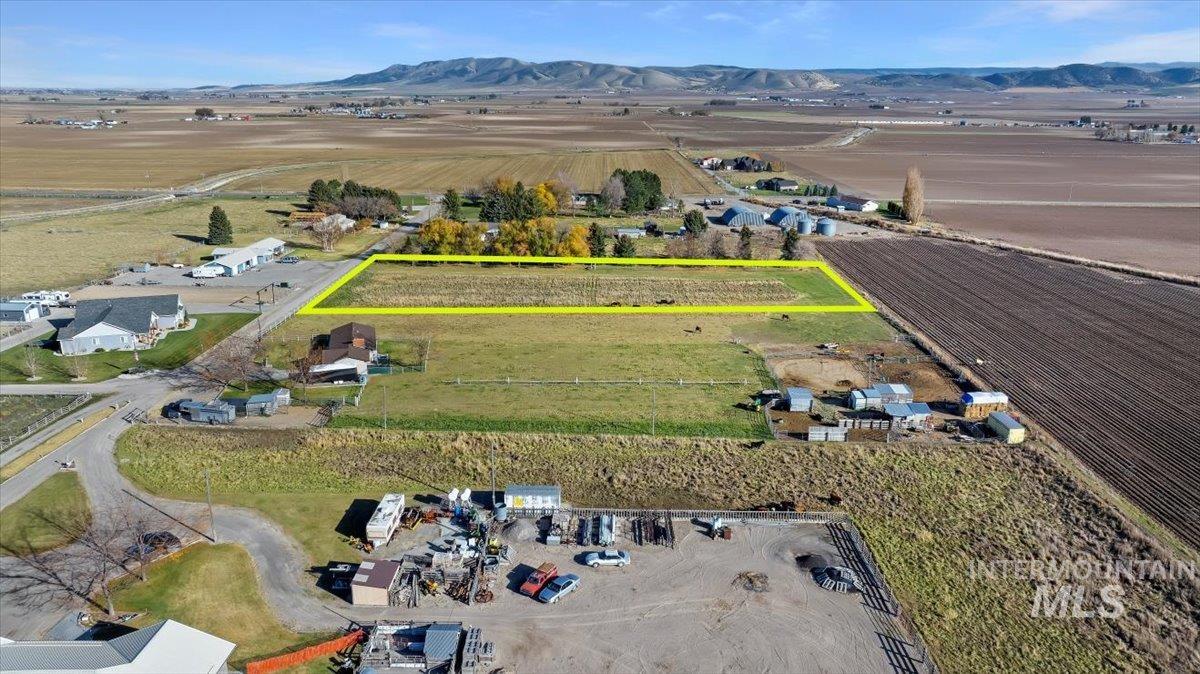 Aerial view of property's location featuring property parcel outlined and rural landscape