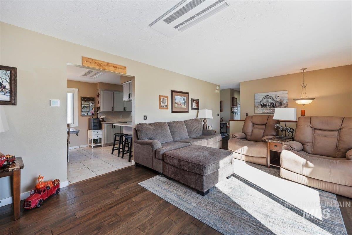 Living room with wood finished floors and baseboards