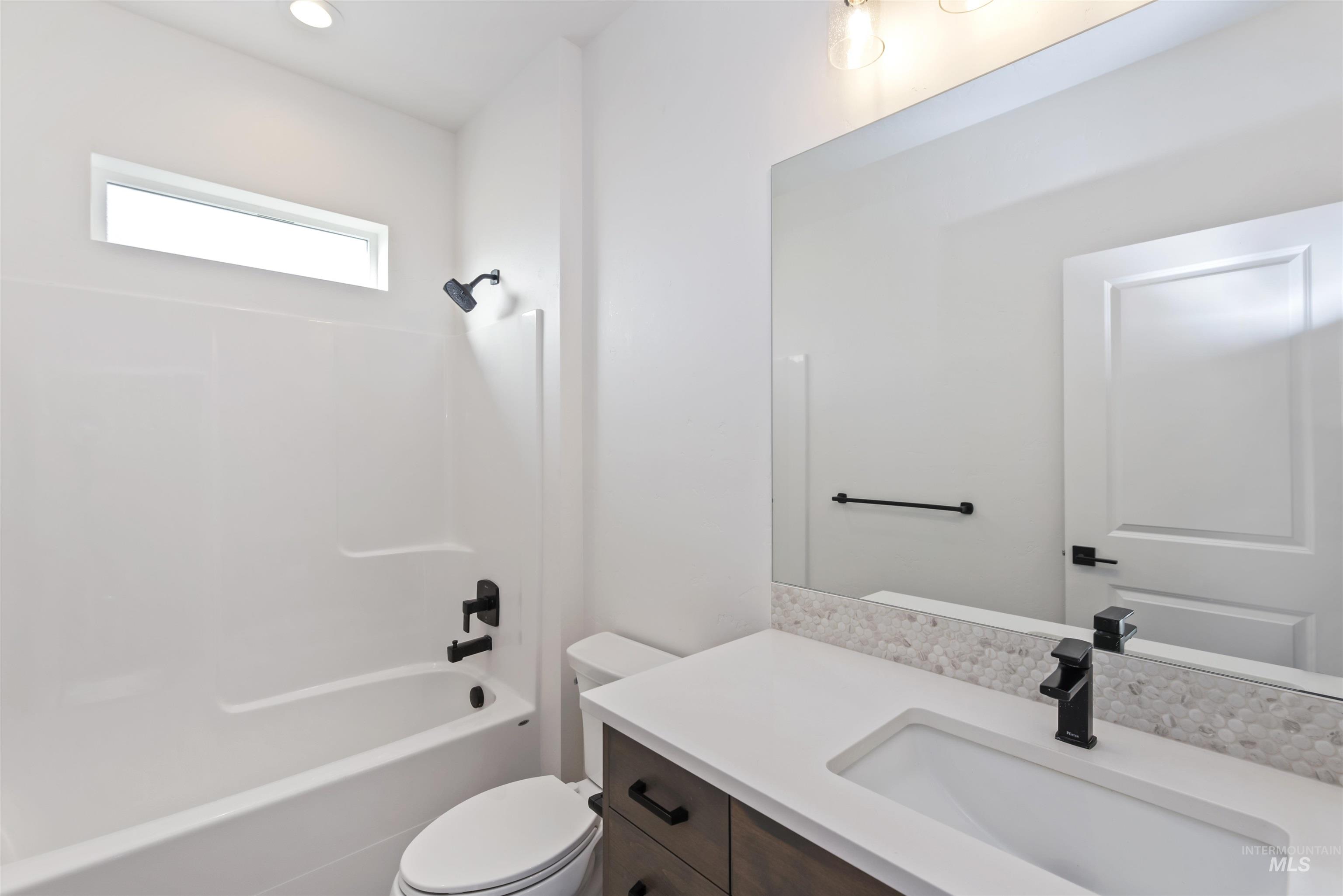 Bathroom with bathtub / shower combination and vanity
