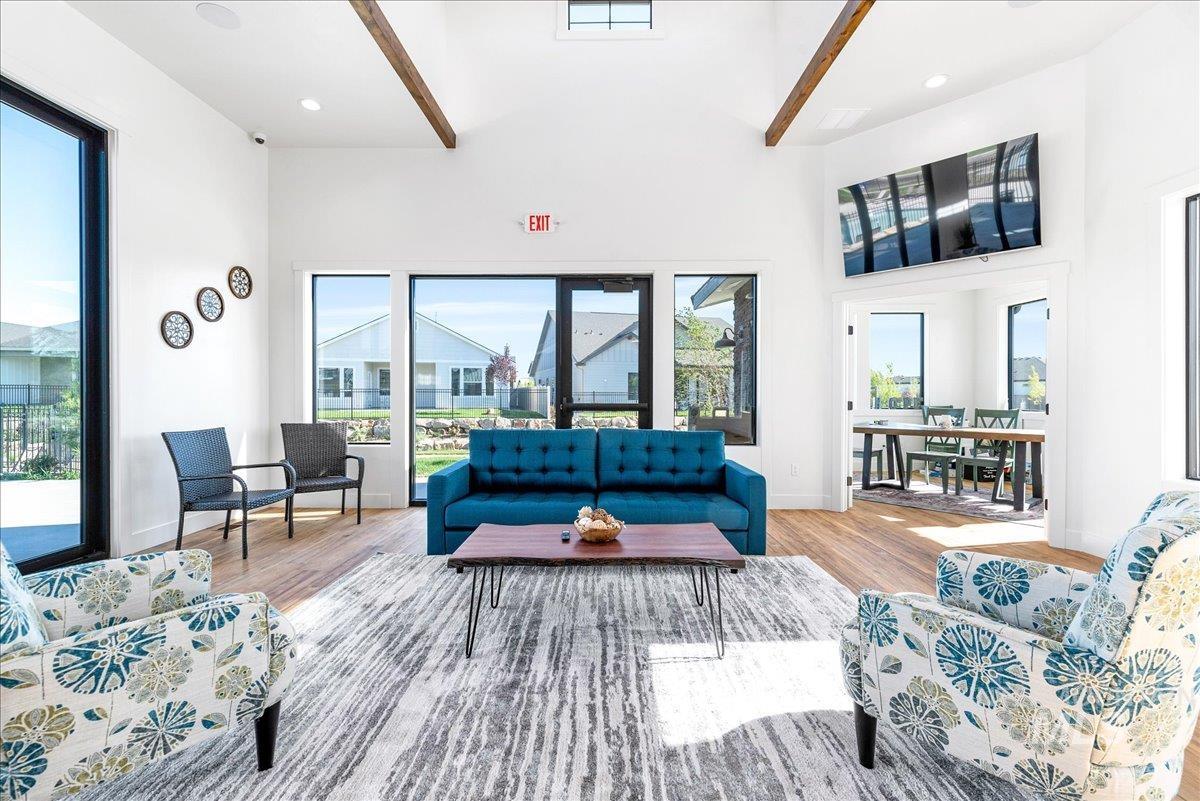 Living room featuring recessed lighting, wood finished floors, and high vaulted ceiling