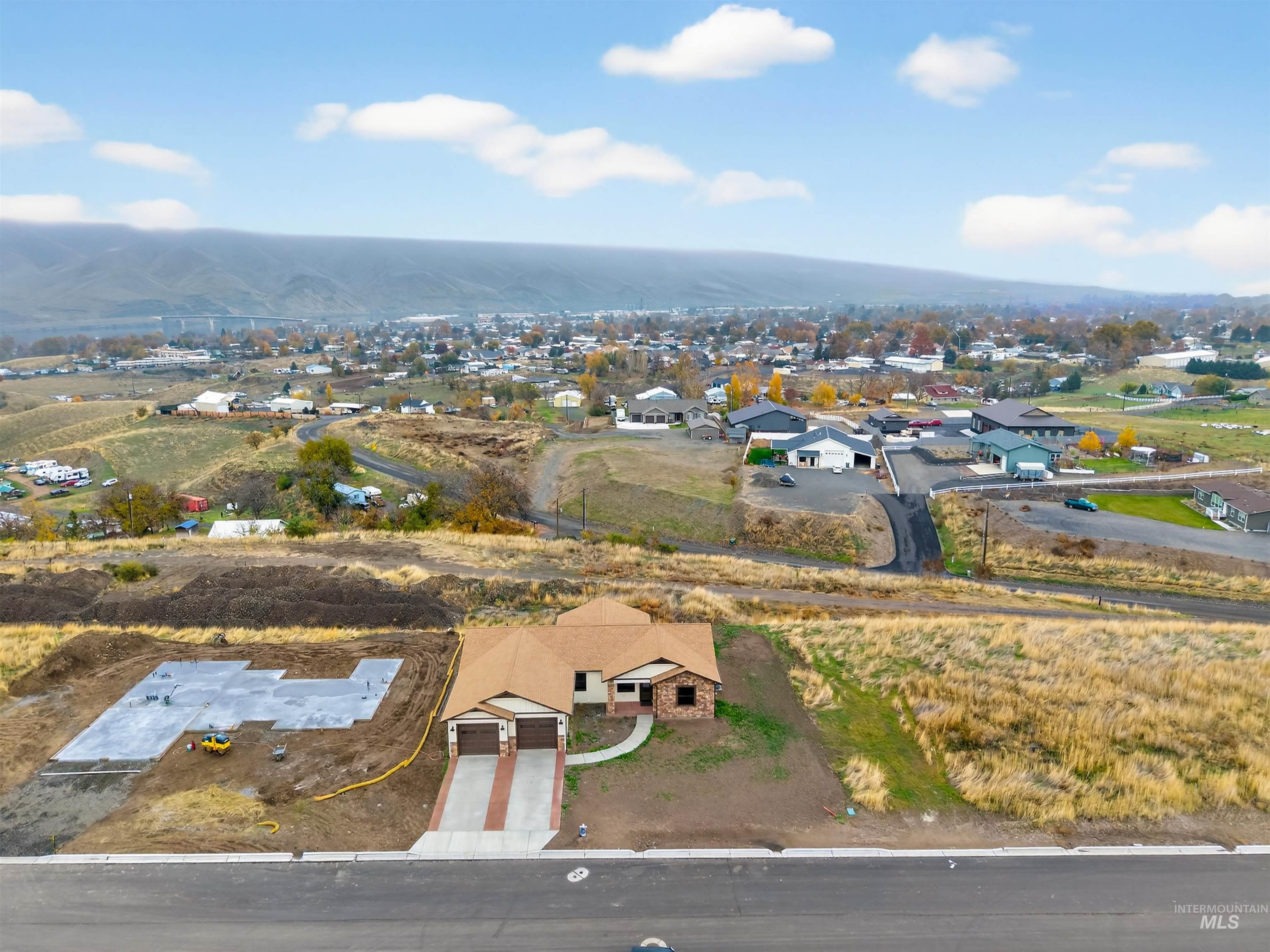 View of property location with nearby suburban area