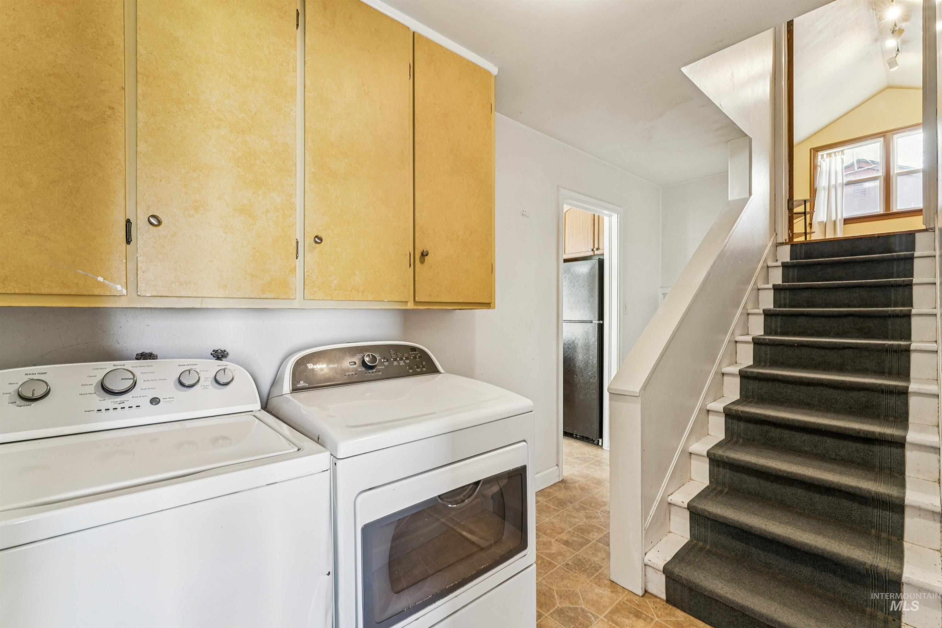 Washroom with independent washer and dryer and cabinet space